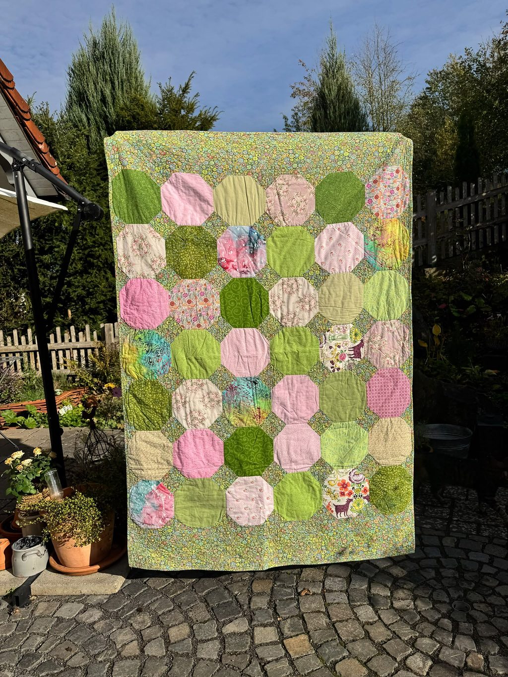 Snowflaked Corner balls: Inspired by the end of winter and the Kaffe Fassett fabric I used for the sashing and the border. Machine pieced and quilted. Free-motion quilting.